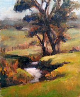 Oil painting of two manna gums beside a creek with distant hills.