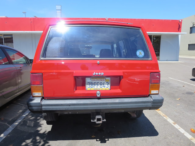 Shiny new paint on Jeep Cherokee after repairs at Almost Everything Auto Body