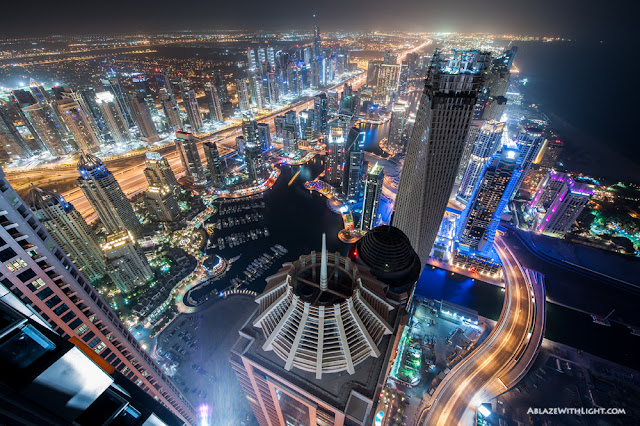 Photo of city lights and the skyscrapers at night as seen from the Princess Tower