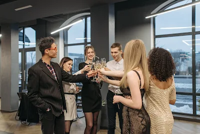 Office workers toast the New Year with champagne