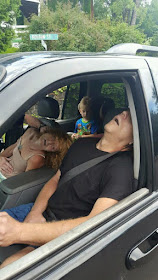 The photos show James Acord, 50, and Rhonda Pasek, 47, passed out in the front seat of their Ford Explorer, their mouths agape (wide open in surprise or wonder), as the 4 years old child stares silently into the camera from the back.