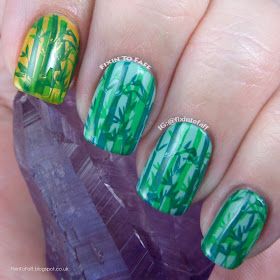 Double-stamped green bamboo forest nail art.