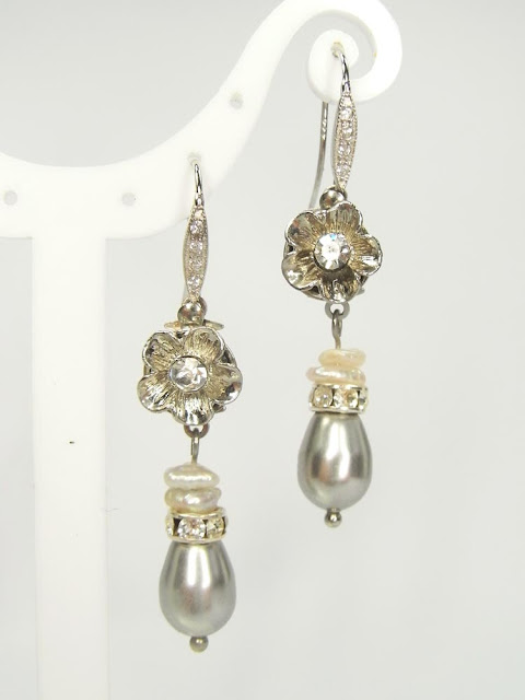 Silver, crystal and pearl drop earrings in neutral shades of grey and cream.