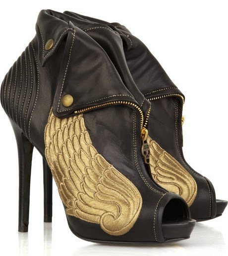 The boots hold a 5 inch heel front zip botton flaps and the large golden