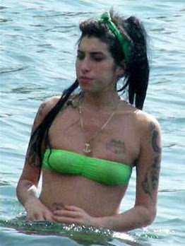 Amy Winehouse and her husband Blake Fielder-Civiland canoodled on a sunshine holiday on the Caribbean isle of St Lucia