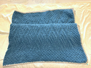 Blue knitted afghan, folded