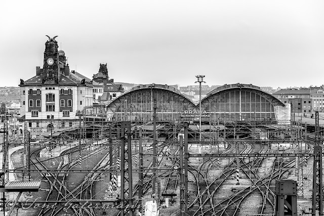 A black and white photograph of Prague's main train station from Vinohradská Street