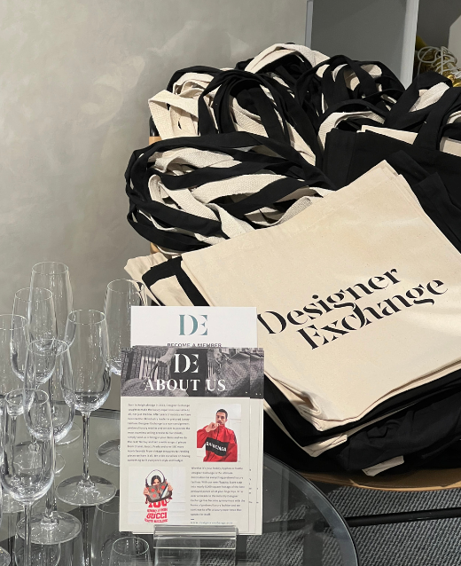 Photo of our open dya gifting area featruing glasses of prosecco, about us flyers as well as complimentary tote bags that were recieved by our first 50 customers