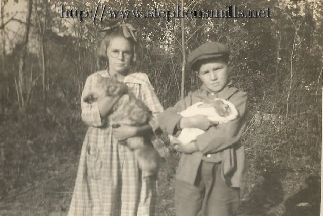 Photo of Harold Proctor and Letty Proctor   with their pet cat and rabbit 