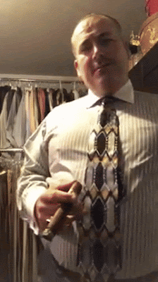 D 3/3 animation of well-dressed man and white shirt smoking a stogie