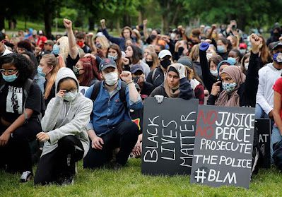 Black lives matter protesters kneeling