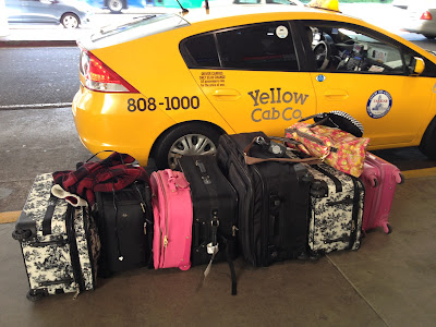 yellow cab company with lots of luggage