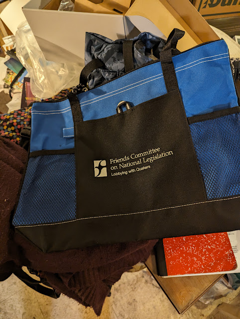 BLue and black tote bag the words "Friends Committee on National Legislation" on it