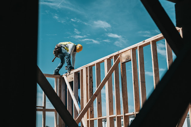construction worker on timber frame:Photo by Josh Olalde on Unsplash