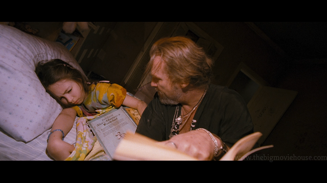 jeff bridges tries to read a book to his daughter