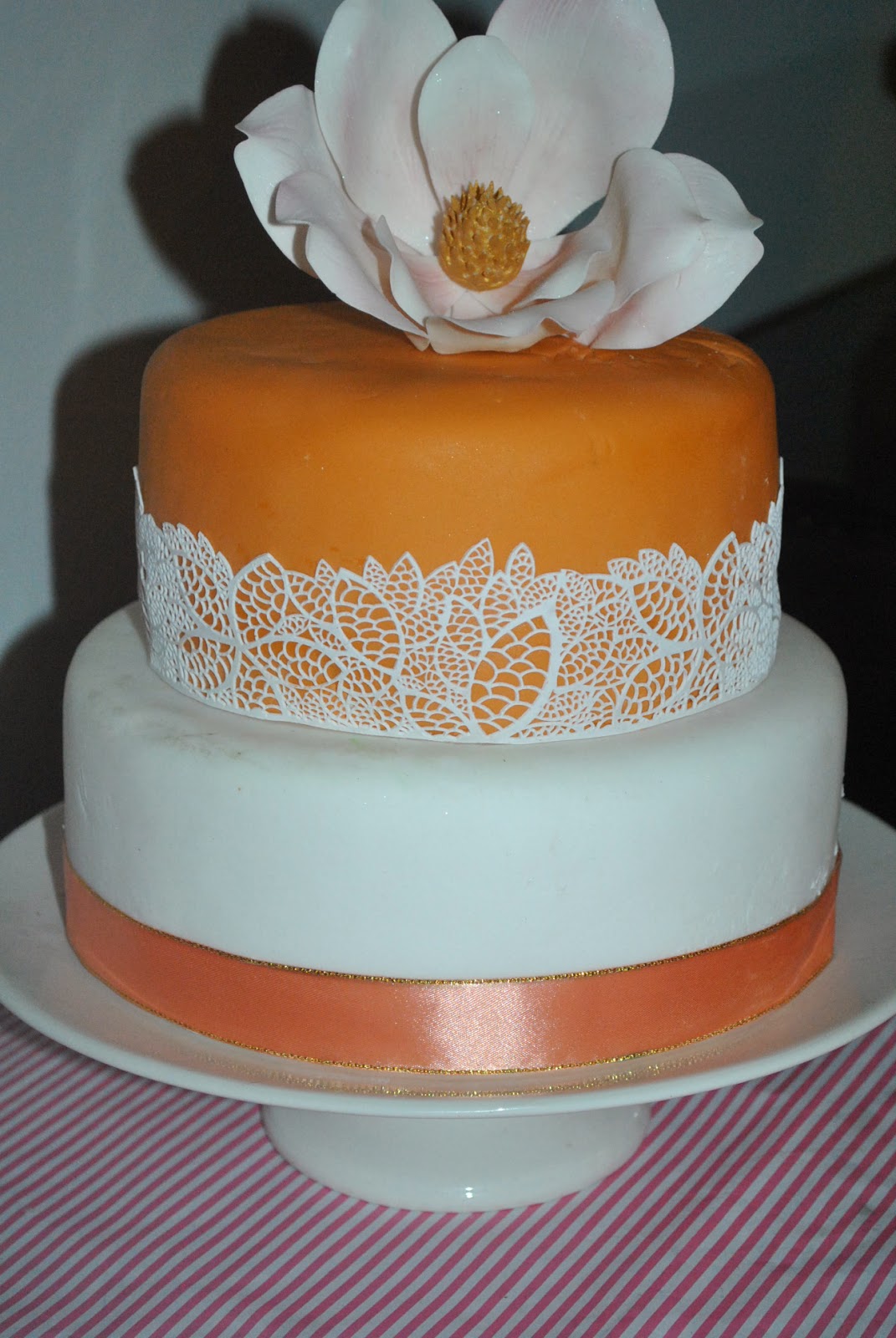 Wedding cake with brown magnolia flowers