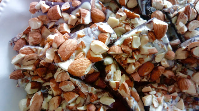 a platter of broken pieces of the finished Toasted Almond Bark