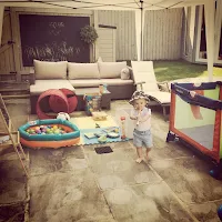 Toddler playing and learning outside musical instruments