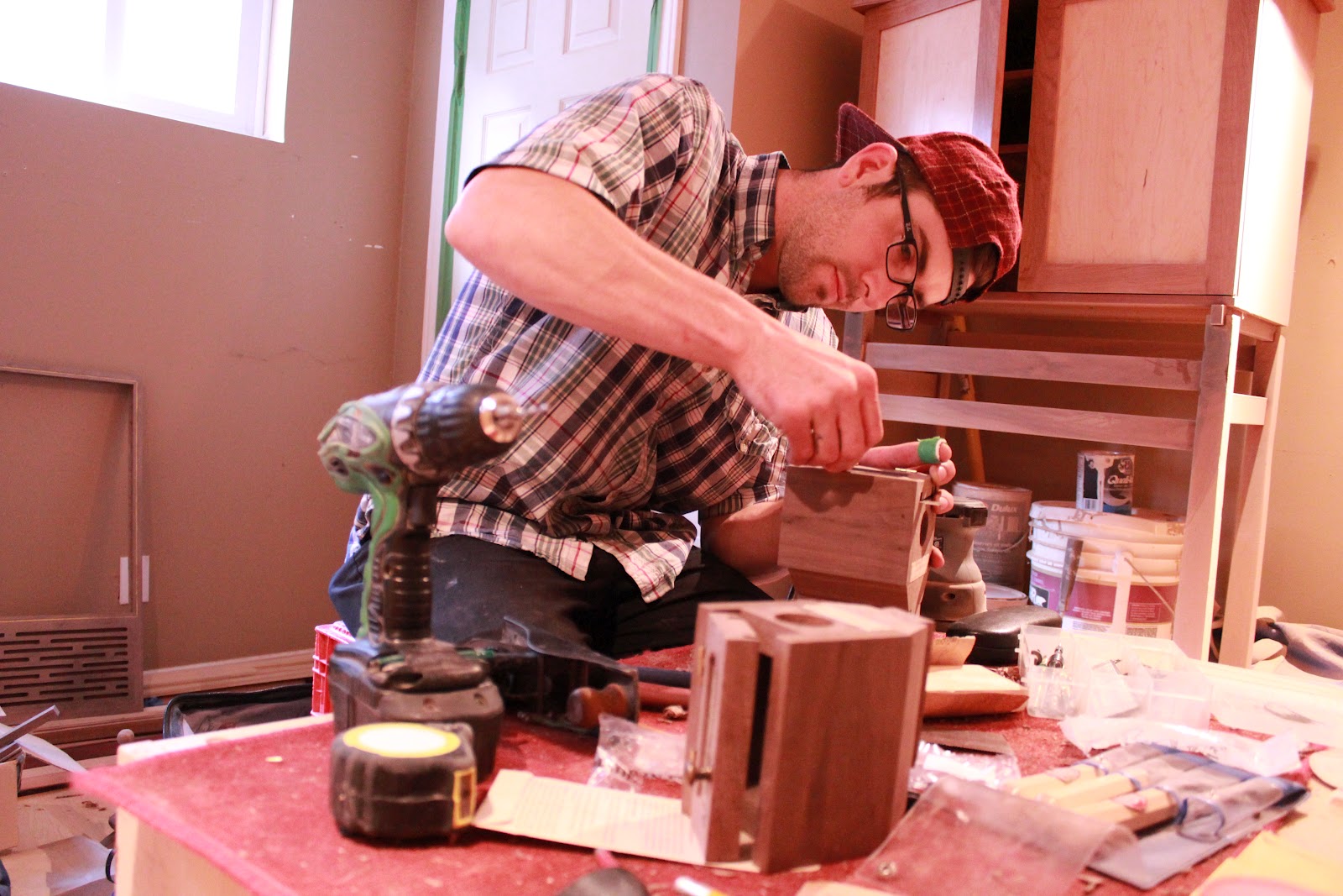 Working away in his studio, finishing up his furniture