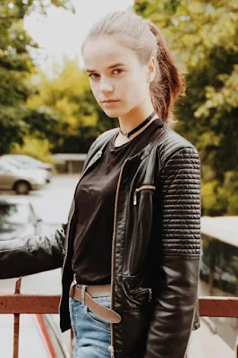 A Girl Wearing Brown Leather Jacket