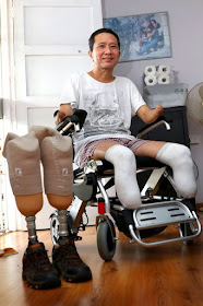 Sitting in his 'Mercedes' motorised wheelchair, Mr Tan Whee Boon's smile is radiant and his attitude jovial.