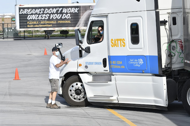 Bill Tovar helps student Debbie Neel in a backing up exercise.