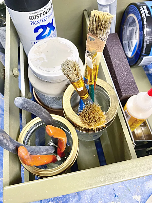 mason jars with gold tops for brushes and tools