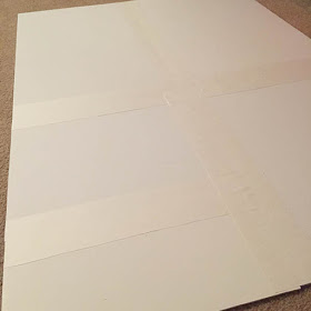 White foam core board glued to the back of a large puzzle