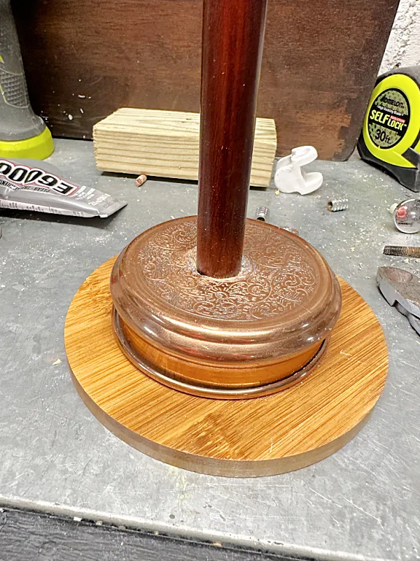 stack of wooden discs, a candle top and a pole