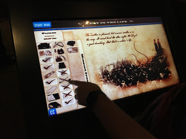 Image of Ben using an interactive display at the Gettysburg museum