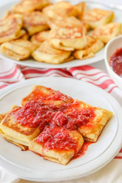 cheese blintz with strawberry sauce