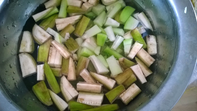 Eggplant, chayote and raw plantain chopped and immersed in salt water