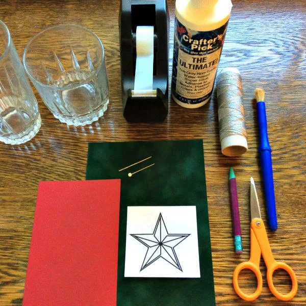 supplies for making a paper stitched star ornament
