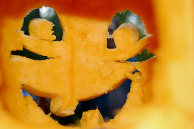 Inside of a jack-o-lantern, looking out.