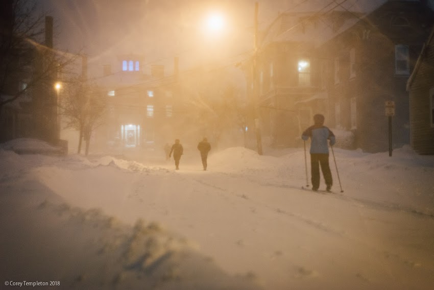 Portland, Maine USA January 2018 photo by Corey Templeton. Skiers and pedestrians take to the streets of the West End, from this evening's snow event.