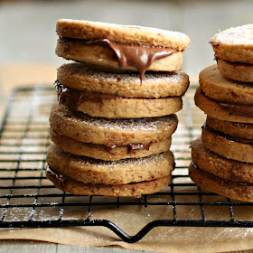 http://www.hungrycouplenyc.com/2014/05/chocolate-and-hazelnut-linzer-cookies.html