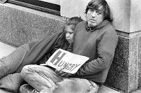 Photo of homeless father and his daughter.