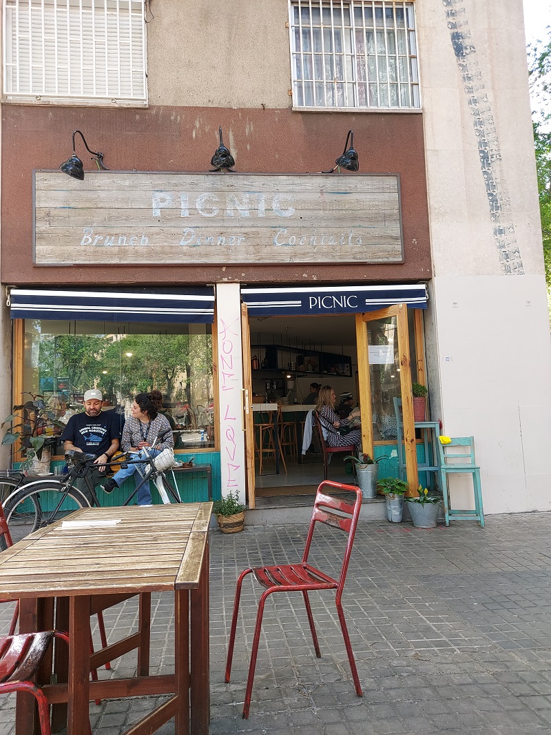 "Brunch - Dinner - Cocktails" - wooden sign above the door of Picnic restaurant in Barcelona