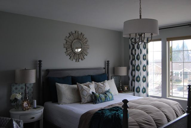 master bedroom, bedroom, bedding, how to make a bed, teal, teal bedding, white bedding, sunburst mirror, mirror over bed