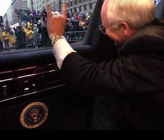 Cheney waves from within an armored limo