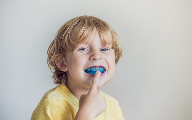 kid wearing a mouthguard