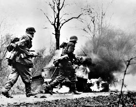 German forces from the german battle group "Kampfgruppe Hansen" (1st SS Panzer-Division LSSAH) are moving up on the Ardennes offensive December, 18 1944.