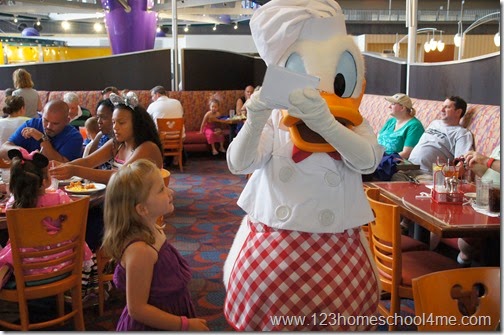 Getting an autograph from Donald Duck at Chef Mickey's at Disney World
