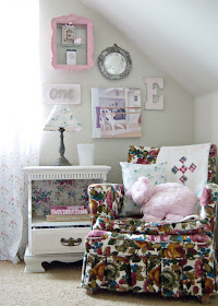 Reading corner - granny chic chair and vintage nightstand framed by gallery wall