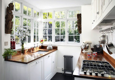 small-kitchen-white-cabinets-brown-countertop