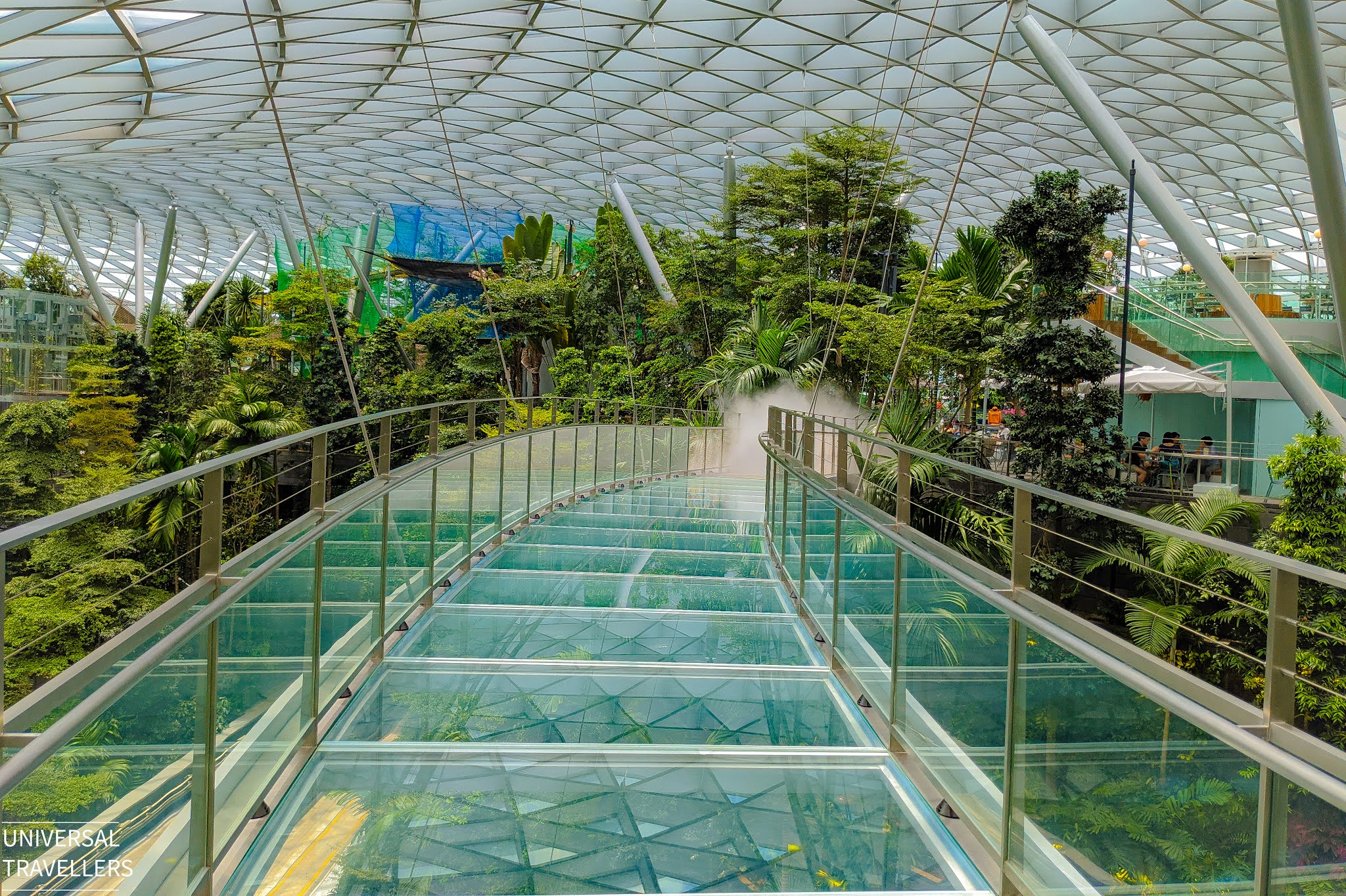 Foggy mist emerging from the ends of the Canopy Bridge, located at level 5 of the Jewel Changi Airport