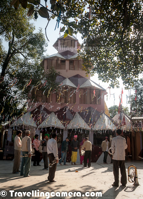  Recently I was at my hometown in Mandi, Himachal Pradesh and got to visit this wonderful place called Nawahi Devi with some ancient temples.This place has least visibility on web and feeling great to post about this wonderful hill station with ancient temples. Let's check out this Photo Journey to know more about this place and what more to expect...Here is a view of Shiva Temple around one of the corners in campus of Mata Nawahi Devi Temple. This portion of Nawahi Devi Temple looked most interesting to me and spend most of the time around the same. Nawahi Devi Temple has huge space and different temples dedicated to various gods including Luxmi-Narayan and Shiva.Just outside the main temple area, there is a huge water pond which was dry in the month of November. There is a beautiful temple in the middle of this water temple which is accessible through a bridge connected to main road. Imagine the time of year when this pond is full of water and we walk over the bridge to have a glimpse inside this colorful temple. Town having this temple is known as 'Nawahi Devi' and is quite lively place as compared to other towns around it. Nawahi Devi has various shops with pooja stuff, a governement schools and relevant shops with kids' stuff.There is a banyan tree in the campus of Nawahi Devi Temple. Married couples come to this place just after the marriage and then at the later stage to put wedding-bangles (chooda) and Sehra around it's branches.Here is a photographs of Nawahi Mata Statue placed inside the main temple with huge structure around it. Main temple of Nawahi devi is just in front of main gate and there is hardly any walk from road to the gate. It's just next to the main road with connects Sarkaghat with Jahu, which is part of Hamirpur District. Various people from distant places come to Nawahi Devi.Here is a photograph of top part of main temple in the campus of Nawahi Devi Temple