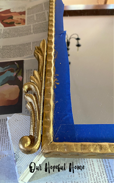 detailed gold leaf mirror corner