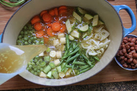 Food Lust People Love: Spring Minestrone is the perfect light meal, with tender young vegetables in a clear broth, topped with crème fraîche. You can, of course, substitute whatever fresh from the garden veggies you have available.