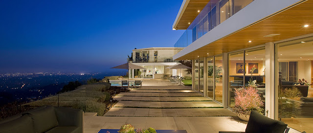 Picture of large terrace with swimming pool and the view at night